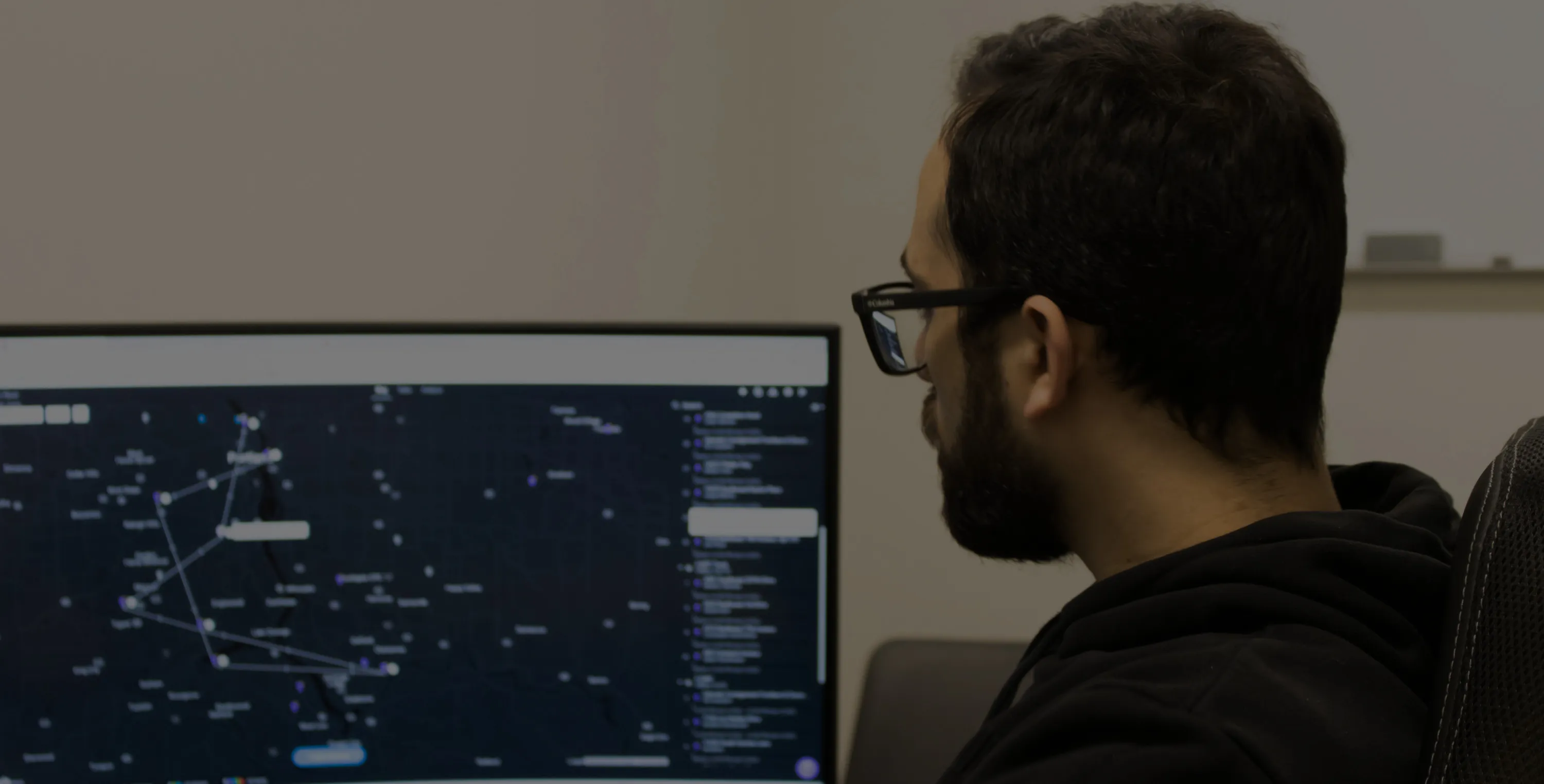 MTF team member reviewing inventory in the client portal on a monitor