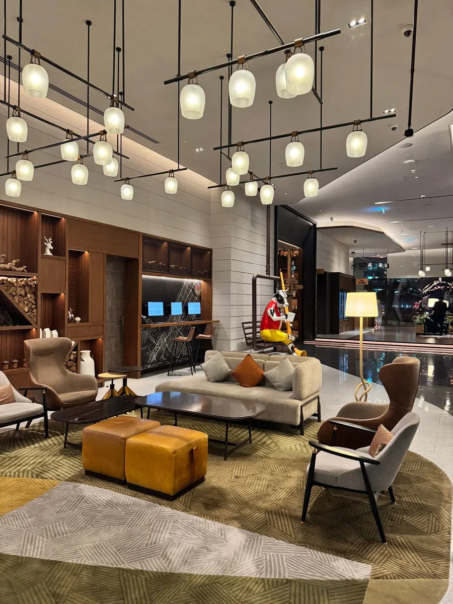 Hotel lobby lounge with designer furniture and pendant lighting