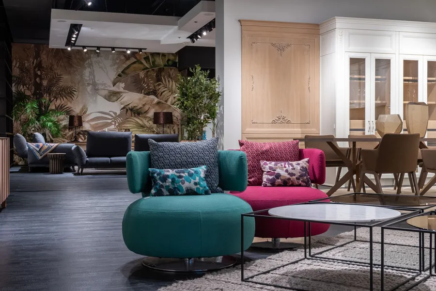 Furniture showroom with upholstered chairs, sofa and coffee tables